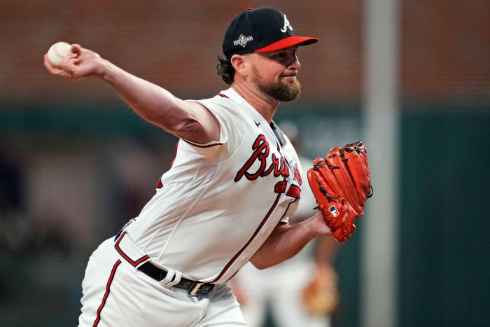 Oct 9, 2023; Cumberland, Georgia, USA; Atlanta Braves relief pitcher Kirby Yates (22) pitches during the fifth inning against the Philadelphia Phillies in game two of the NLDS for the 2023 MLB playoffs at Truist Park.